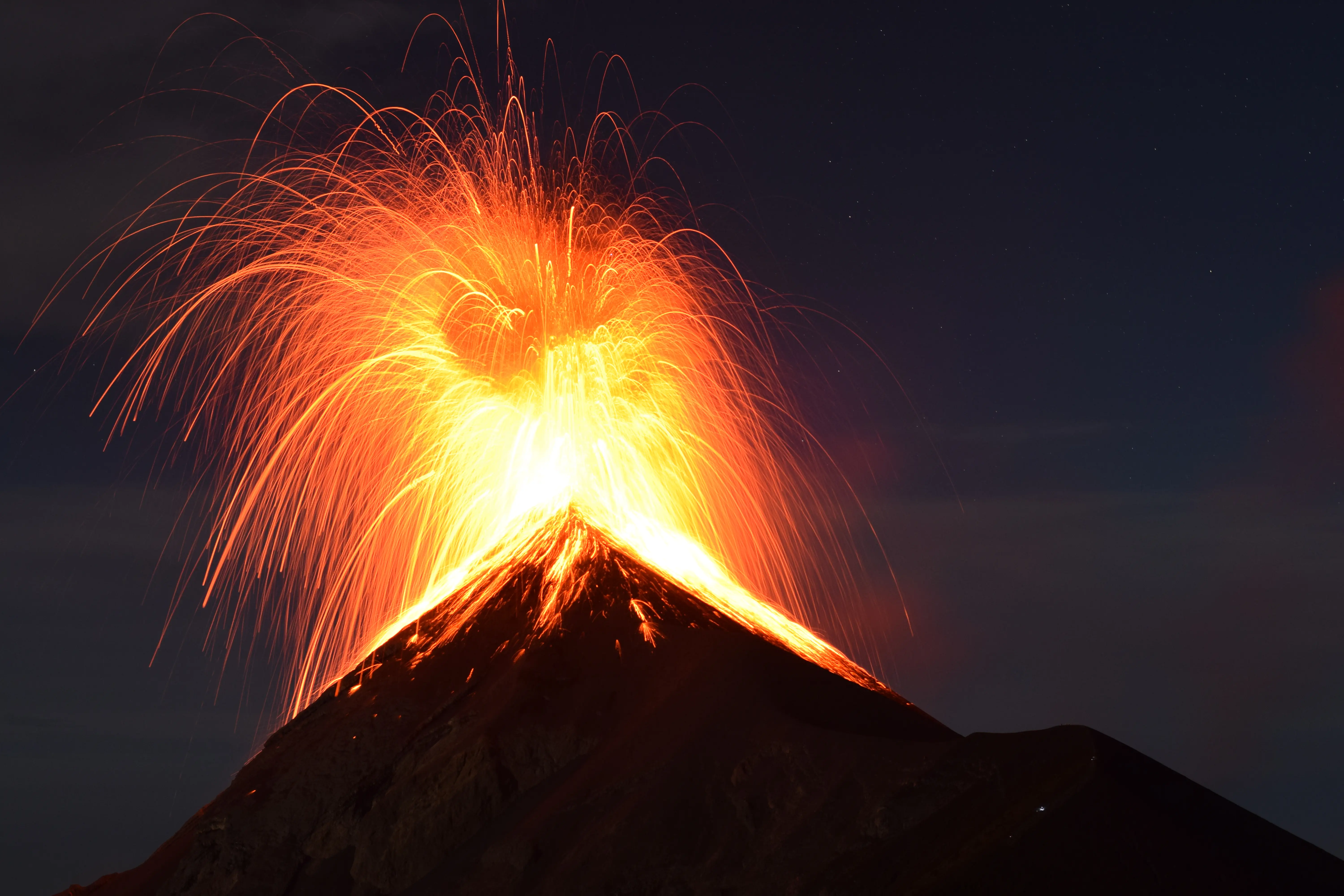 Hiker preparing for Acatenango volcano hike near Antigua Guatemala