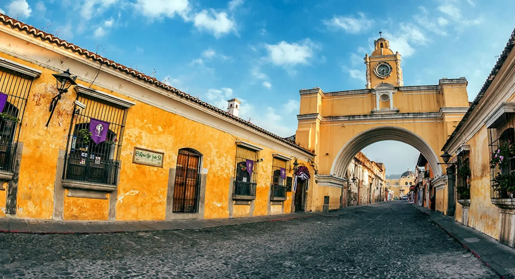 Travelers walking in Antigua Guatemala without luggage after storing bags